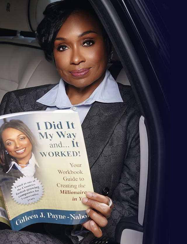 Colleen J. Payne holding her book 'I Did It My Way and It Worked'